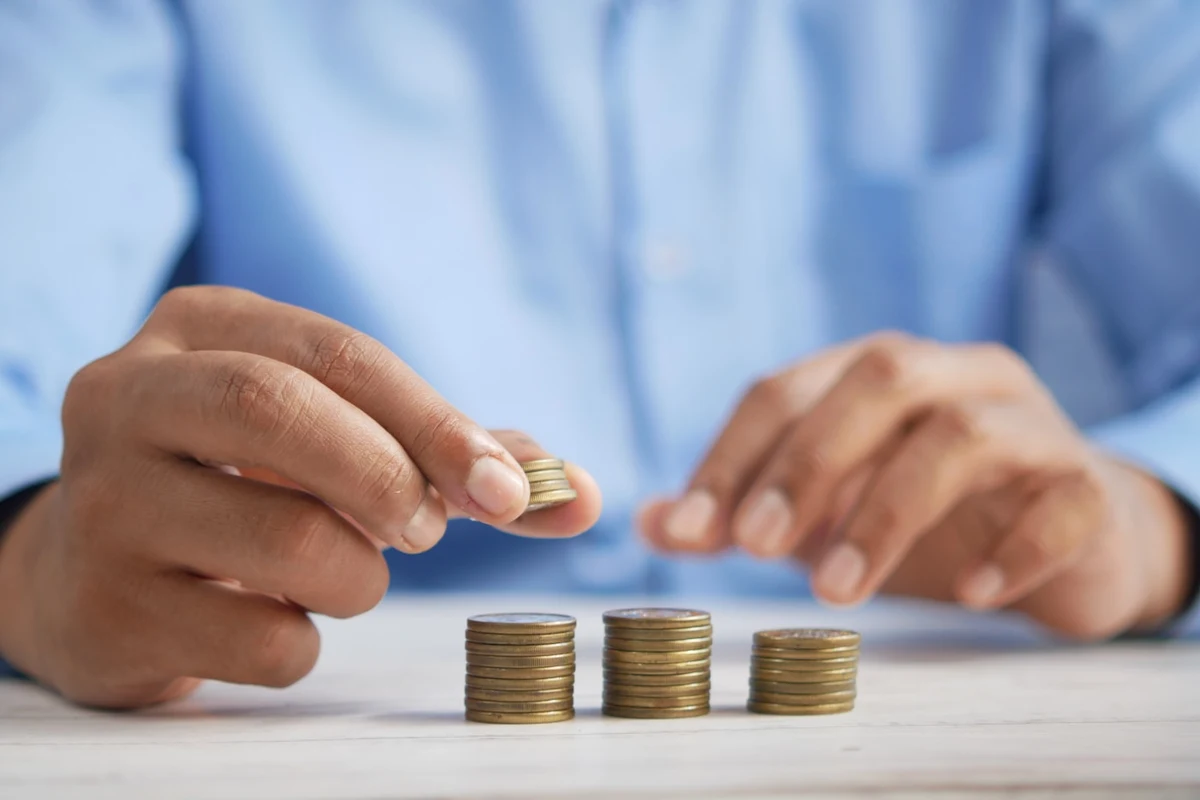 Three stacks of coins of increasing height, built one coin at a time